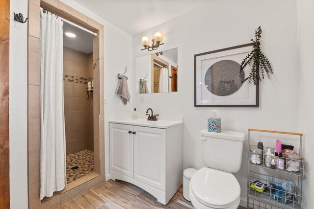 1524 W Meadowlark Ln, Corrales, NM 87048 - full bathroom with vanity, a tile shower, and wood finished floors