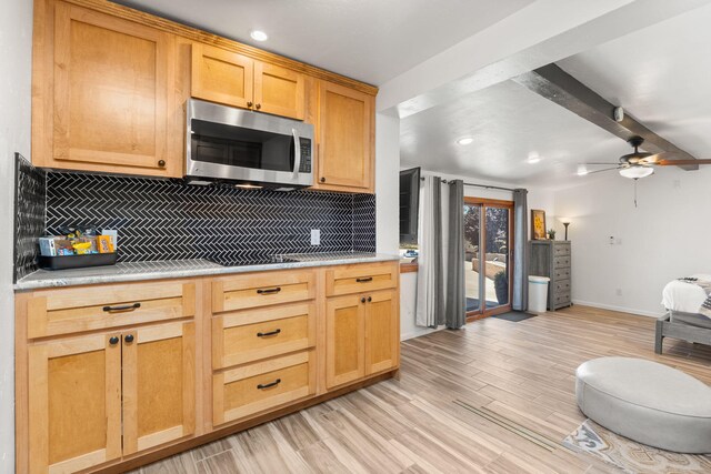 1524 W Meadowlark Ln, Corrales, NM 87048 - kitchen featuring stainless steel microwave, backsplash, light countertops, ceiling fan, and recessed lighting