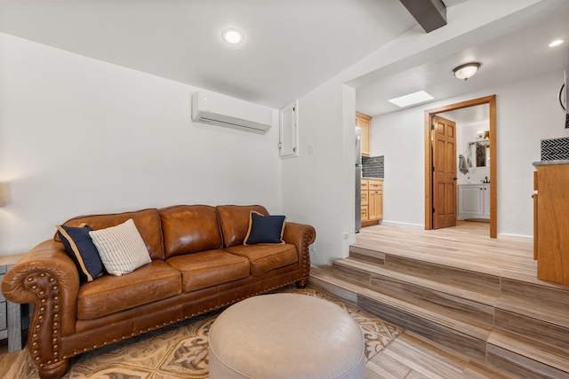 1524 W Meadowlark Ln, Corrales, NM 87048 - living area with a wall mounted air conditioner, light wood finished floors, recessed lighting, and beam ceiling