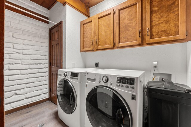 1524 W Meadowlark Ln, Corrales, NM 87048 - laundry area with cabinet space, light wood-style flooring, and independent washer and dryer