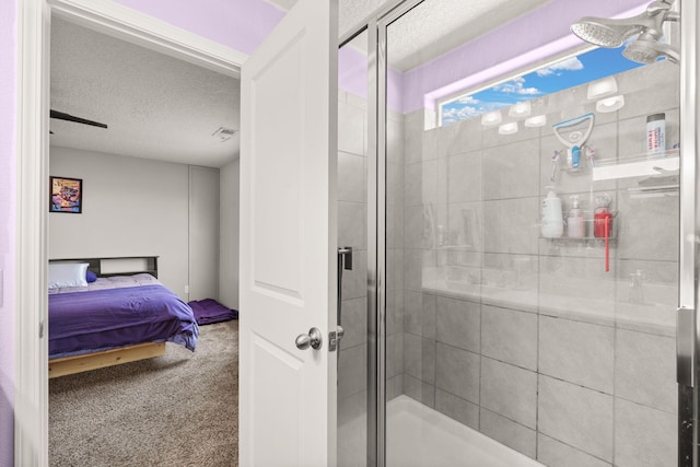 9909 Saddlehorn Trl SW, Albuquerque, NM 87121 - ensuite bathroom with a textured ceiling and a shower stall