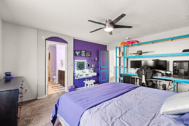 9909 Saddlehorn Trl SW, Albuquerque, NM 87121 - bedroom featuring carpet floors, a textured ceiling, a ceiling fan, and ensuite bath