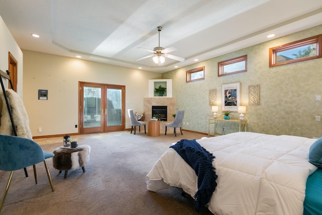 13527 Cedarbrook Ave NE, Albuquerque, NM 87111 - bedroom featuring access to exterior, recessed lighting, a fireplace, multiple windows, and a raised ceiling