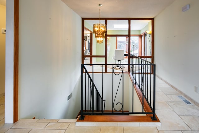 13527 Cedarbrook Ave NE, Albuquerque, NM 87111 - stairway with a chandelier