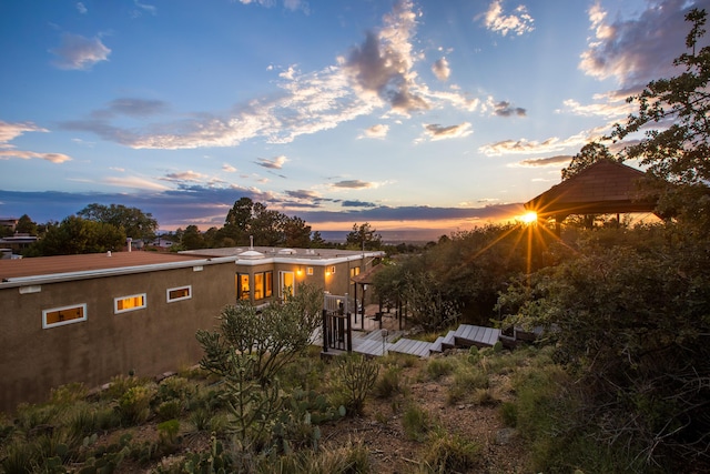 13527 Cedarbrook Ave NE, Albuquerque, NM 87111 - back of house at dusk with stucco siding