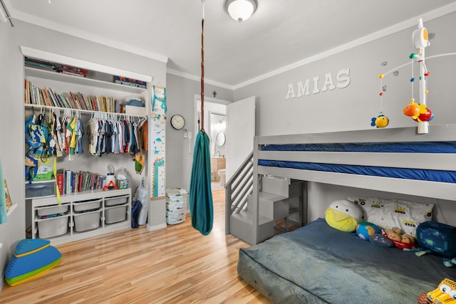 11608 Clifford Ave NE, Albuquerque, NM 87112 - bedroom with wood finished floors, ornamental molding, and a closet