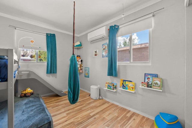 11608 Clifford Ave NE, Albuquerque, NM 87112 - bedroom with a wall unit AC, wood finished floors, and ornamental molding