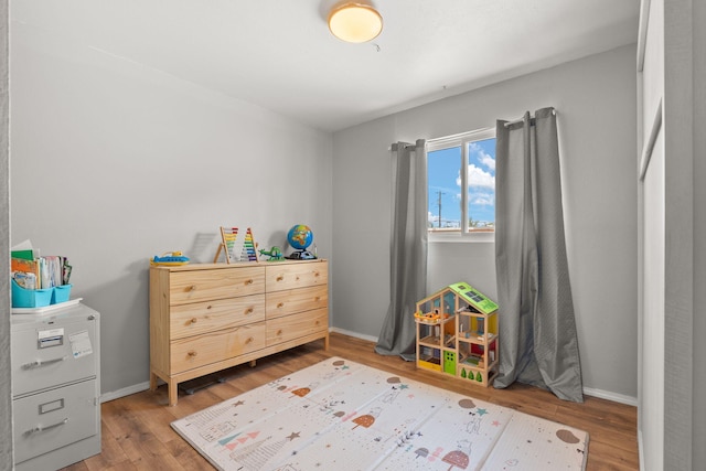 11608 Clifford Ave NE, Albuquerque, NM 87112 - playroom with wood finished floors and baseboards