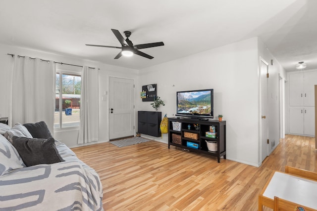 11608 Clifford Ave NE, Albuquerque, NM 87112 - living room featuring light wood-style flooring and ceiling fan