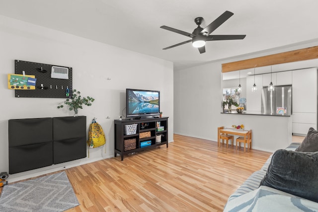11608 Clifford Ave NE, Albuquerque, NM 87112 - living area with light wood-style floors and a ceiling fan