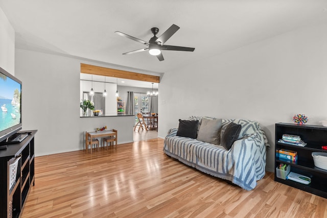 11608 Clifford Ave NE, Albuquerque, NM 87112 - living room featuring a chandelier, a ceiling fan, and wood finished floors