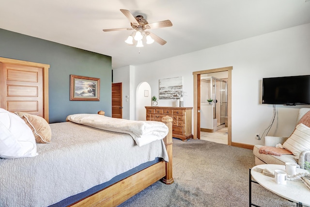 276 Trosello Ln, Corrales, NM 87048 - bedroom with light carpet, ensuite bath, ceiling fan, and arched walkways