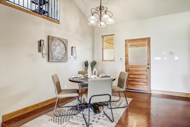 276 Trosello Ln, Corrales, NM 87048 - dining space with a chandelier, finished concrete floors, and a towering ceiling