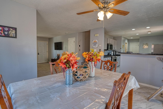 10405 Red Robin Rd SW, Albuquerque, NM 87121 - dining room with ceiling fan, a textured ceiling, marble finish floors, and recessed lighting