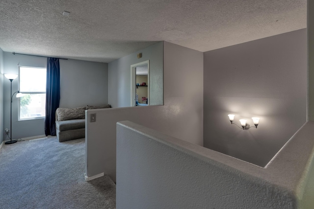 10405 Red Robin Rd SW, Albuquerque, NM 87121 - hallway with carpet flooring, a textured ceiling, and an upstairs landing