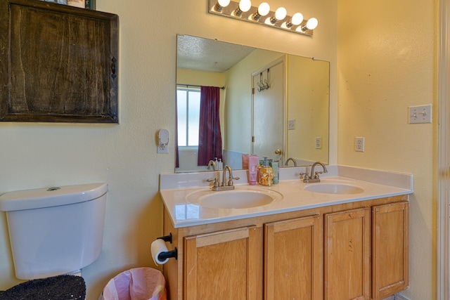 10405 Red Robin Rd SW, Albuquerque, NM 87121 - bathroom featuring double vanity and toilet