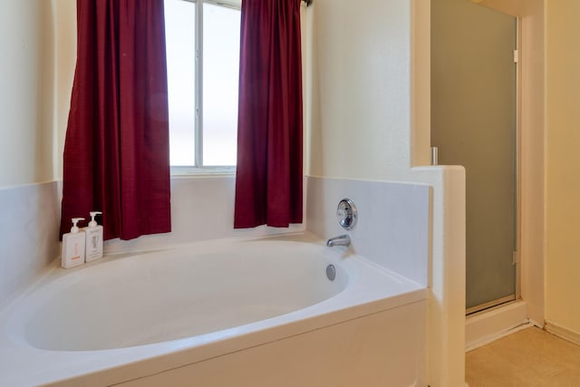 10405 Red Robin Rd SW, Albuquerque, NM 87121 - bathroom featuring a garden tub and a shower stall