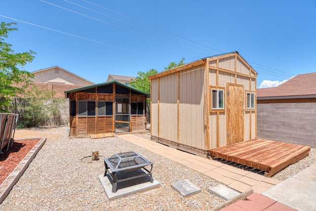 10405 Red Robin Rd SW, Albuquerque, NM 87121 - view of outdoor structure with a fire pit
