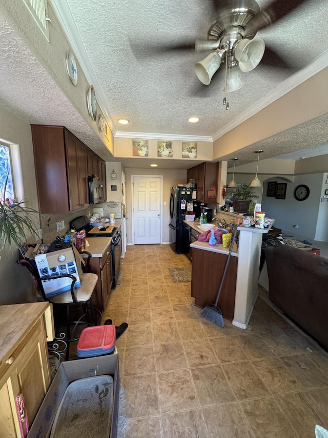 6356 Azaleas Rd NW, Albuquerque, NM 87114 - kitchen featuring black appliances, crown molding, a textured ceiling, a ceiling fan, and light countertops