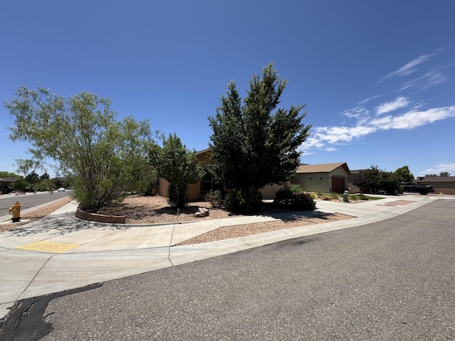 6356 Azaleas Rd NW, Albuquerque, NM 87114 - obstructed view of property with concrete driveway