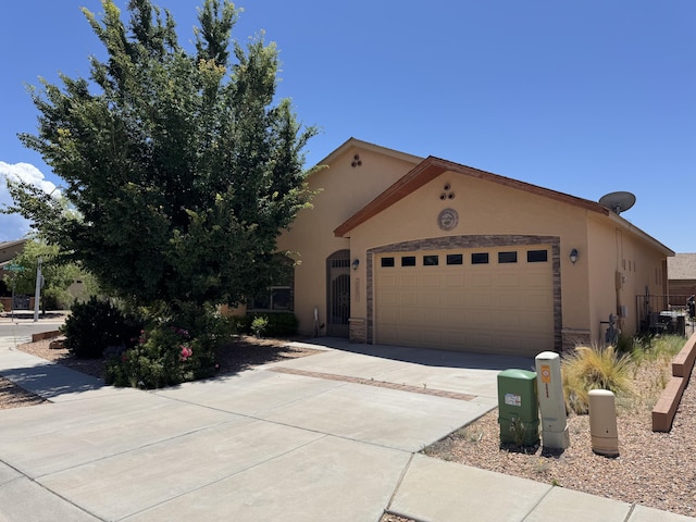 6356 Azaleas Rd NW, Albuquerque, NM 87114 - view of front of home featuring stucco siding, an attached garage, and driveway