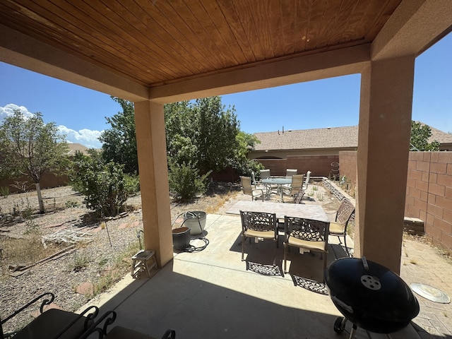 6356 Azaleas Rd NW, Albuquerque, NM 87114 - fenced backyard with outdoor dining area and a patio