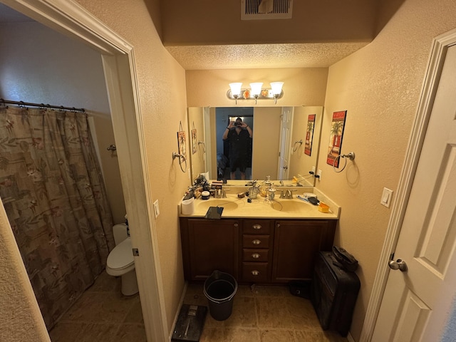 6356 Azaleas Rd NW, Albuquerque, NM 87114 - full bath with a textured wall, double vanity, tile patterned floors, and curtained shower