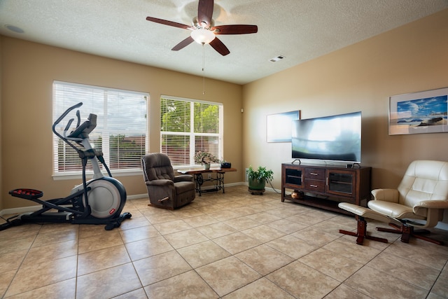 3726 Linda Vista Ave NE, Rio Rancho, NM 87124 - workout room with a textured ceiling, ceiling fan, and light tile patterned floors