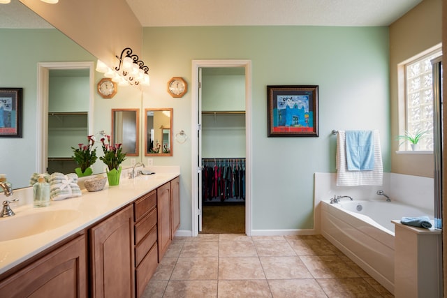3726 Linda Vista Ave NE, Rio Rancho, NM 87124 - full bathroom featuring double vanity, a bath, a walk in closet, and tile patterned floors