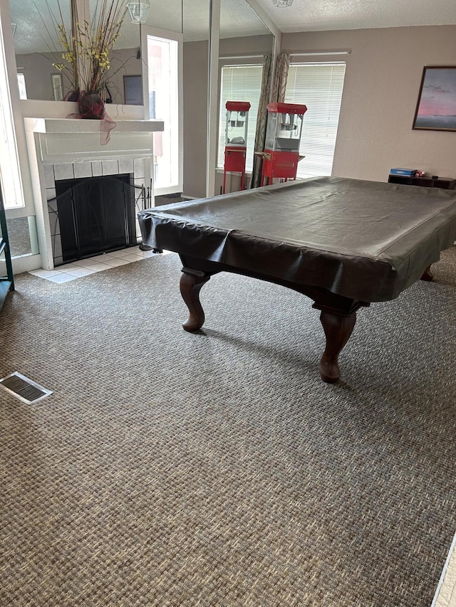 3847 Montgomery Blvd NE Unit 923, Albuquerque, NM 87109 - recreation room featuring pool table, a tiled fireplace, carpet, and a textured ceiling