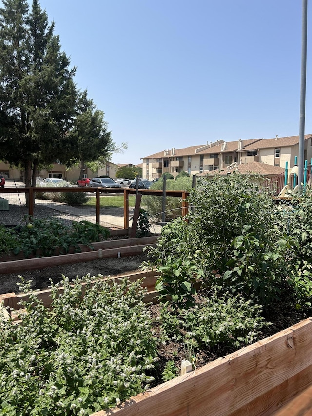 3847 Montgomery Blvd NE Unit 923, Albuquerque, NM 87109 - view of yard with a vegetable garden and a residential view