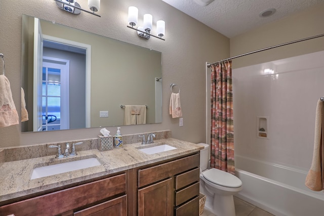 2952 Kings Canyon Loop NE, Rio Rancho, NM 87144 - bathroom featuring double vanity, shower / bathtub combination with curtain, a textured ceiling, and tile patterned flooring