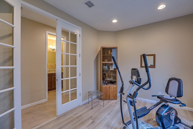 2952 Kings Canyon Loop NE, Rio Rancho, NM 87144 - exercise room with french doors, recessed lighting, and light wood-type flooring