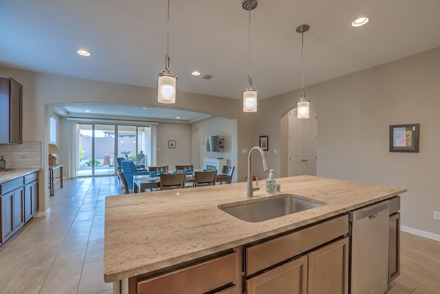 2952 Kings Canyon Loop NE, Rio Rancho, NM 87144 - kitchen featuring dishwasher, recessed lighting, arched walkways, decorative light fixtures, and decorative backsplash