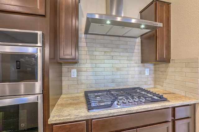 2952 Kings Canyon Loop NE, Rio Rancho, NM 87144 - kitchen featuring wall chimney range hood, appliances with stainless steel finishes, and tasteful backsplash