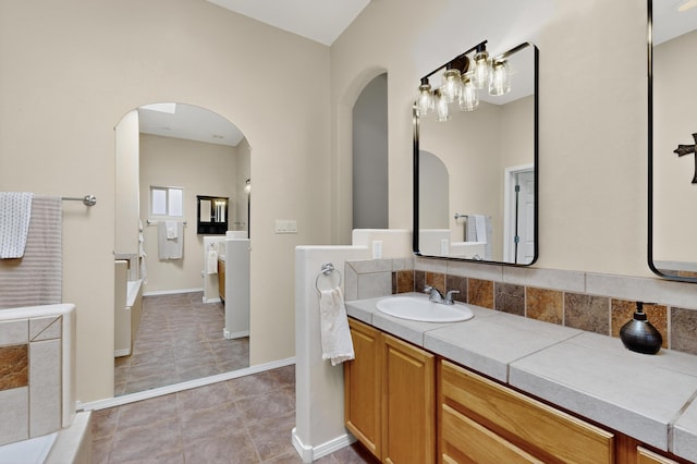 2504 Campeche Rd NE, Rio Rancho, NM 87144 - full bathroom featuring vanity, a bath, and tile patterned flooring