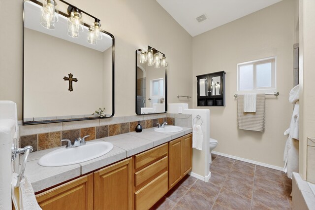 2504 Campeche Rd NE, Rio Rancho, NM 87144 - bathroom with double vanity and toilet