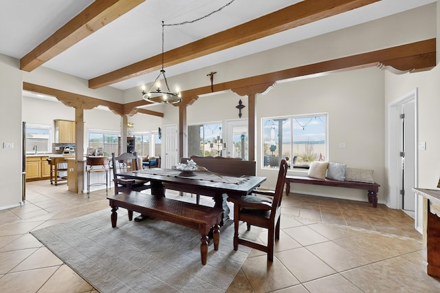 2504 Campeche Rd NE, Rio Rancho, NM 87144 - dining space featuring beam ceiling, light tile patterned flooring, and a chandelier