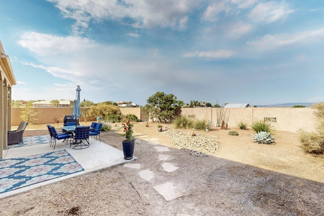 2504 Campeche Rd NE, Rio Rancho, NM 87144 - fenced backyard featuring a patio