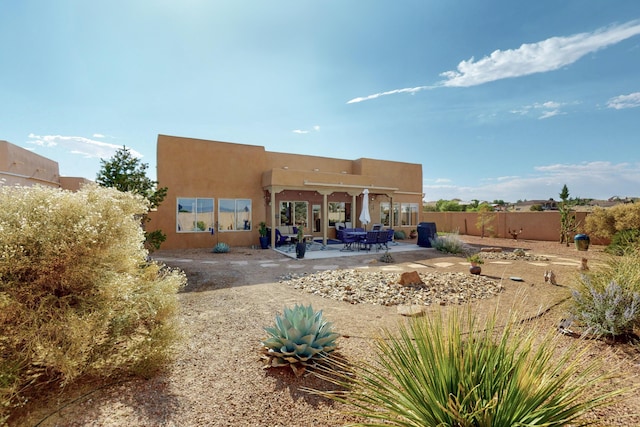 2504 Campeche Rd NE, Rio Rancho, NM 87144 - rear view of property with a patio and stucco siding