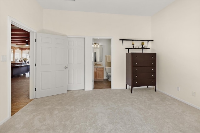 2504 Campeche Rd NE, Rio Rancho, NM 87144 - carpeted bedroom with baseboards and ensuite bathroom