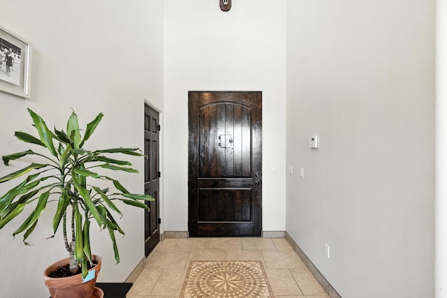 76 Otero Rd, Los Lunas, NM 87031 - entrance foyer featuring a towering ceiling and light tile patterned flooring
