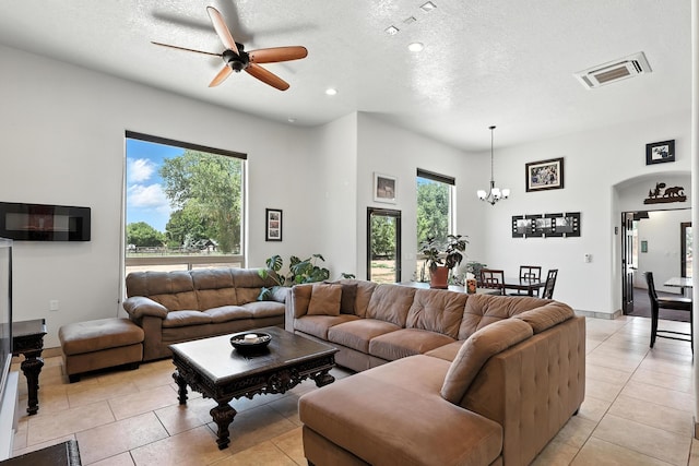 76 Otero Rd, Los Lunas, NM 87031 - living area featuring light tile patterned floors, ceiling fan, a textured ceiling, a chandelier, and recessed lighting
