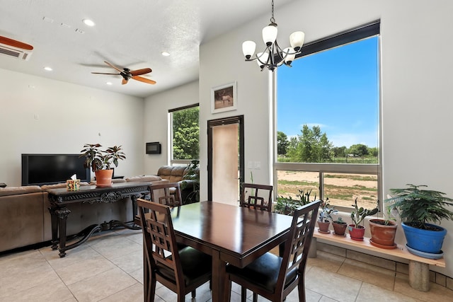 76 Otero Rd, Los Lunas, NM 87031 - dining room featuring light tile patterned floors, recessed lighting, a ceiling fan, and a chandelier