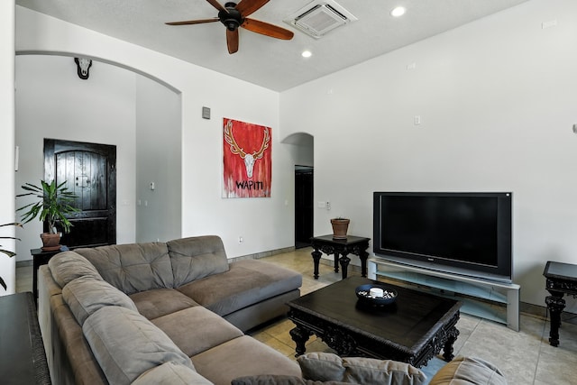 76 Otero Rd, Los Lunas, NM 87031 - living room with arched walkways, a ceiling fan, and recessed lighting
