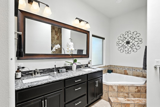 76 Otero Rd, Los Lunas, NM 87031 - bathroom with double vanity and a bath
