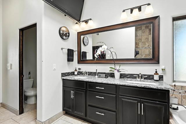 76 Otero Rd, Los Lunas, NM 87031 - bathroom with double vanity, tile patterned floors, and healthy amount of natural light