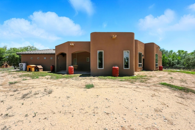 76 Otero Rd, Los Lunas, NM 87031 - back of house featuring stucco siding