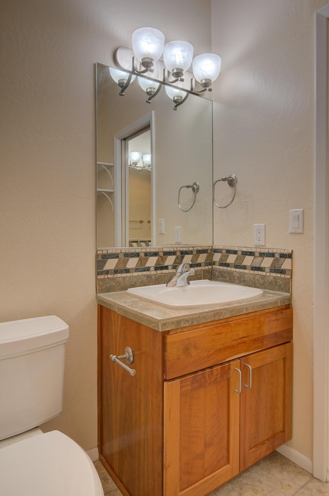 315 11th St SW, Albuquerque, NM 87102 - half bath with vanity and tile patterned flooring