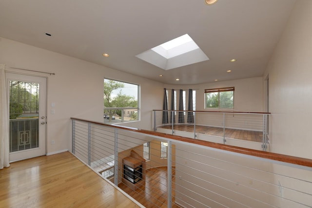 315 11th St SW, Albuquerque, NM 87102 - corridor with a skylight, recessed lighting, and wood finished floors